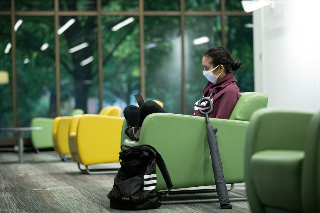 A student studying alone in the UIC Library IDEA Commons