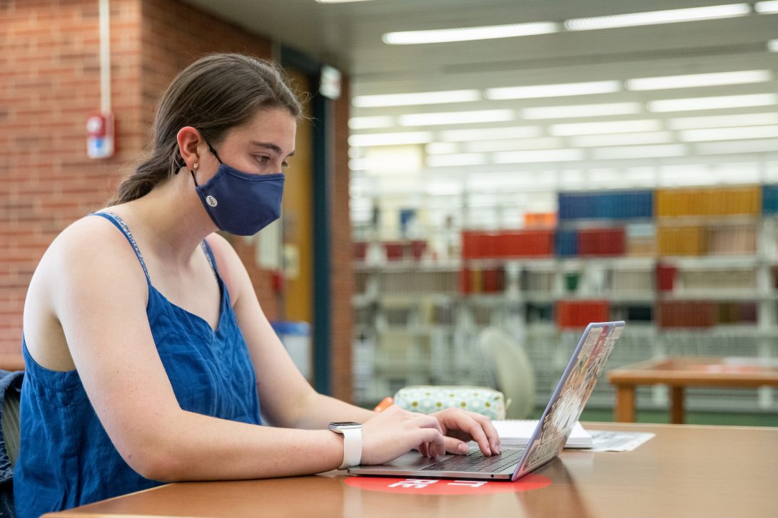 Student working at a laptop at the Library of the Health Sciences, Chicago.