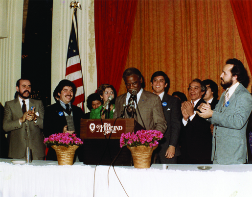 Community activist Rodolfo “Rudy” Lozano, (second from left) who attended the University of Illinois Chicago in the 1970s and was instrumental in the election of Mayor Harold Washington (center), is the subject of a new exhibit at the Richard J. Daley Library on the UIC campus. (Photo: Rodolfo “Rudy” Lozano archives)
