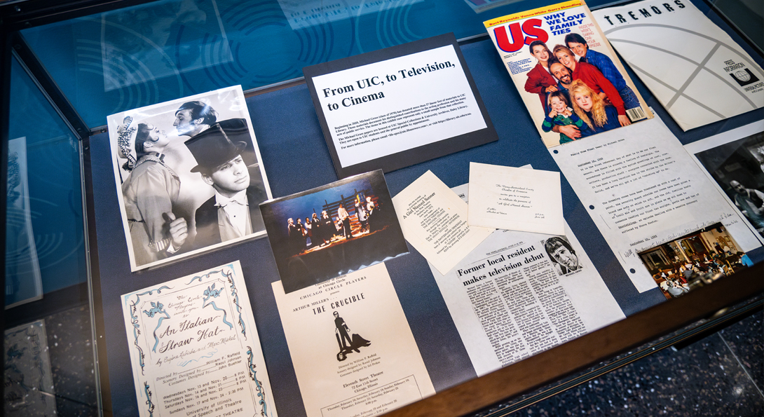 Documents from the Michael Gross collection on display in a glass case.