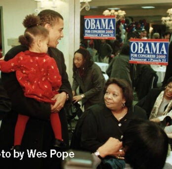 Barack Obama, Democratic candidate in primary for 1st District representative in Congress, awaits election results at the Ramada Inn surrounded by his family and supporters on March 21, 2000. Photo by Wes Pope. 